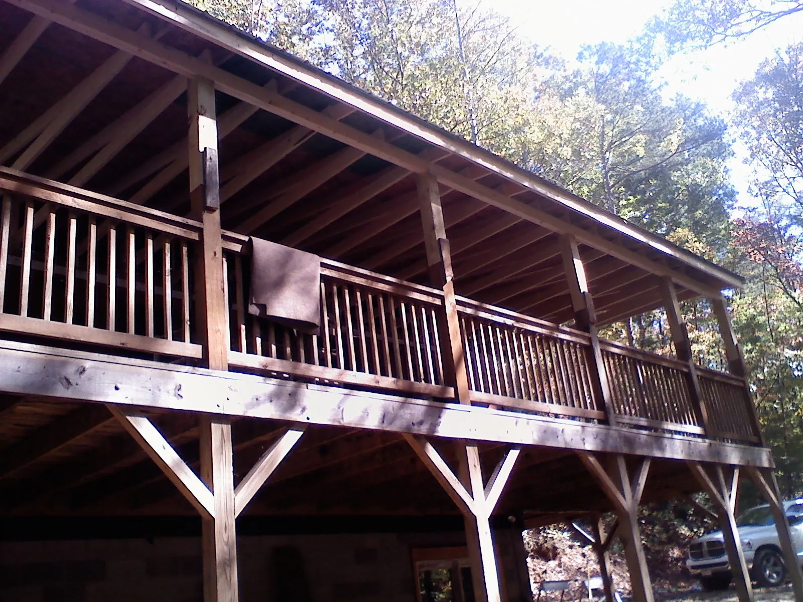 Timber framing under a new elevated porch and deck — Roof Leak Repair in New Paris by Roofing Brothers
